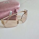 Miu Miu Metal Rimless Wrap Sunglasses