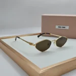 Miu Miu MU 56ZS sunglasses Gold Brown