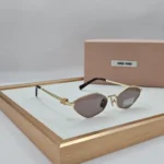 Miu Miu MU 56ZS sunglasses Gold Grey